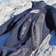 Image for article titled The Foam Fins Covering This Wetsuit Let You Body Surf Without a Board